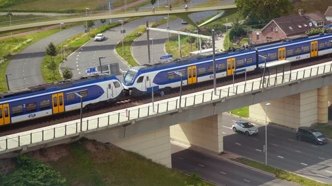 Sprinter train entering at Lent train station, Nijmegen Stock Footage 111346258