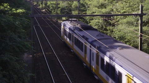 Sprinter train passing underneath Stock Footage 42724385