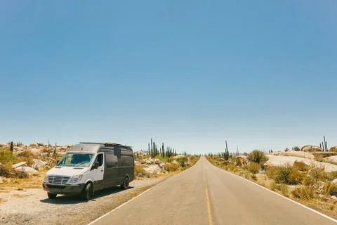 Sprinter van on isolated highway in the desert of Baja, Mexico. Stock Photos