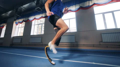Sprinter workouts on a track, wearing modern bionic proshtesis. Stock Footage 105004711
