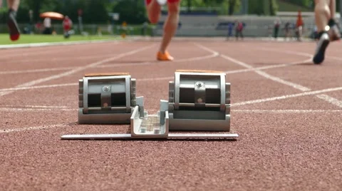Sprinters short track race in a stadium. Lower point of view with camera slider Stock Footage 49553918
