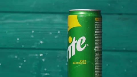 Sprite can covered with water drops on the turquoise background. Video stock 253504765