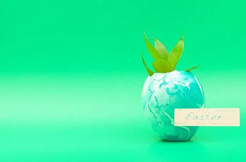 A sprout sprouting from an Easter egg Stock Photos