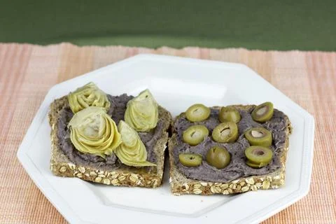 Sprouted Grain Bread, Black Bean Hummus and Vegetables Snack Meal Stock Photos