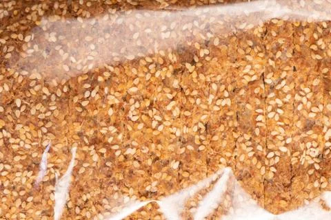 Sprouted Grains Bread Texture in Plastic Wrap Stock Photos
