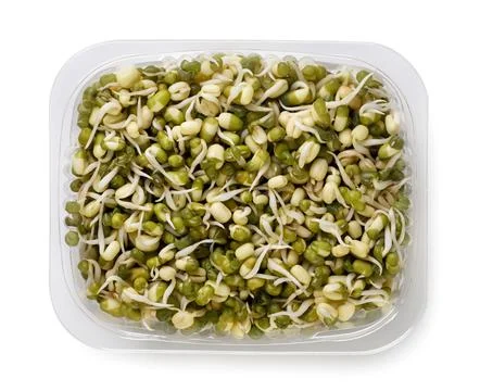 Sprouted mung beans in plastic packaging on white background. Top view Stock Photos