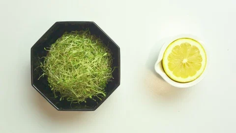 Sprouts in bowl with lemon Stock Footage 76103260