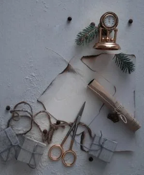 Spruce branches, scissors, ribbons, clock, letter on the table. space for text Stock Photos