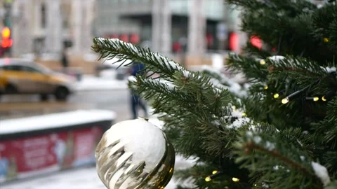 Spruce branches with snow on it and Christmas toys in the foreground and wint Stock Footage 139850042
