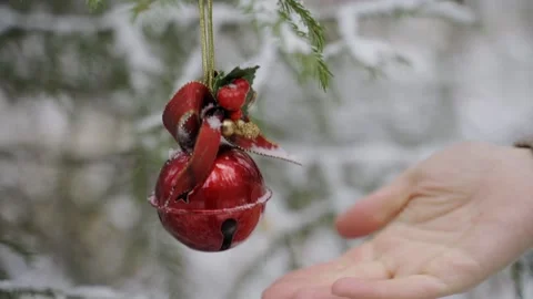 Spruce branches with snow on it and Christmas toys - red balls in the foreground Stock Footage 142066054