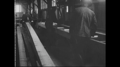 Spruce logs being planed in the saw mill - 1917-18 Stock-Footage 93847366