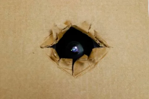 Spy camera hidden fixed behind the cardboard or roof Stock Photos