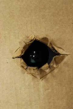 Spy camera hidden fixed behind the cardboard or roof Stock Photos