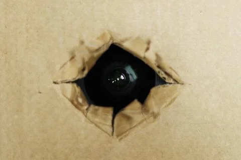 Spy camera hidden fixed behind the cardboard or roof Stock Photos