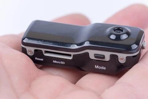 Spy hidden mini camera device in the hand Stock Photos