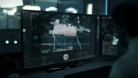 Spy Using Satellite Surveillance Interface In Control Room To Scan Air Base Stock Footage 170390412