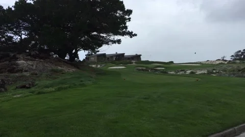 Spyglass hole 5 windy cloudy day from tee box golf course Stock Footage 61863759
