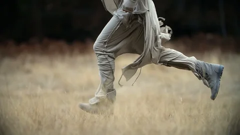 Spying on a running man at fields of Yosemite National Park. Stock Footage 117224876