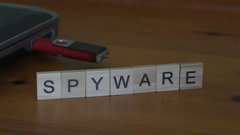 Spyware Concept With Hand Placing Final Letter E In Spyware Word Beside Usb Driv Stock Footage 343578643