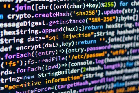 SQL injection. Close-up of hands typing on a computer keyboard with colorfu.. Stock Photos