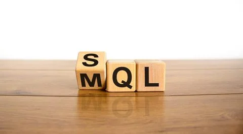 SQL or MQL symbol. Turned wooden cubes and changed words 'MQL marketing quali Stock Photos