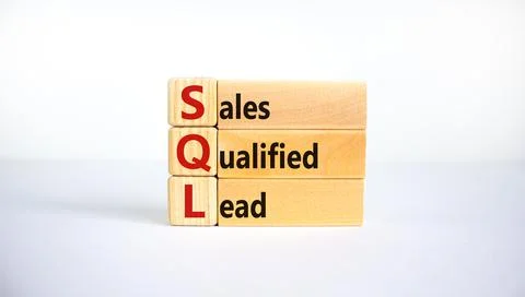 SQL sales qualified lead symbol. Wooden blocks with words 'SQL sales qualifie Stock Photos