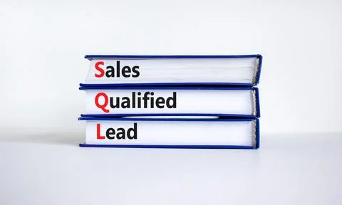 SQL sales qualified lead symbol. Books with words 'SQL sales qualified lead'. Stock Photos