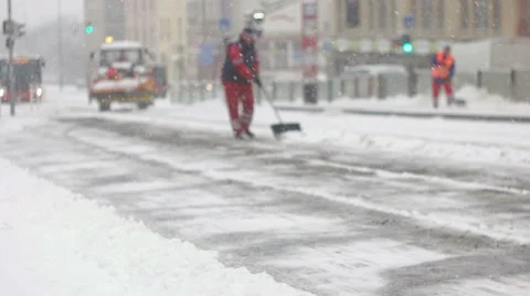 Squad of city workers cleaning snow from station Stock Footage 59649671