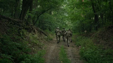 Squad of Five Fully Equipped Soldiers in Camouflage Stock Footage 108422021