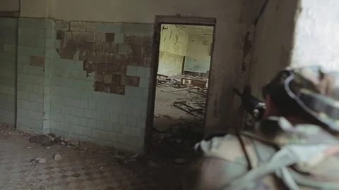 The squad leader gives the soldier the command to storm the room Stock Footage 126027516