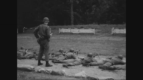 Squad leaders assign a target to squad under the supervision of seniors - 1950 Stock Footage 90460189