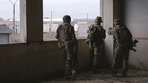 Squad of Soldiers in destroyed building Stock Footage 81672334