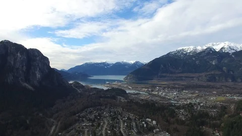 Squamish, BC, Canada viewed by drone flying through the mountains Stock Footage 104924430