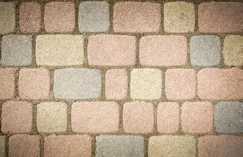 Square and rectangular paving stones of different colors and shades close-up Stock Photos