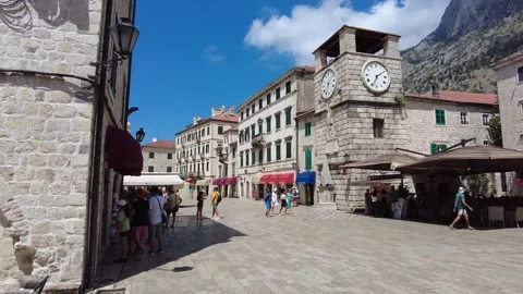 Square of the Arms and the clock tower in the Old City of Kotor Stock Footage 249416151