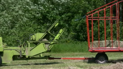 Square baling hay Stock Footage 486037
