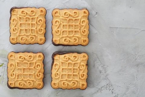 Square biscuits arranged in pattern on light textured background, close-up 스톡 사진