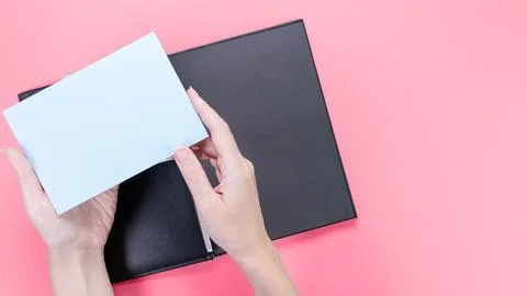 A square blue mockup card with empty space for text and design in hand of y.. Stock Photos