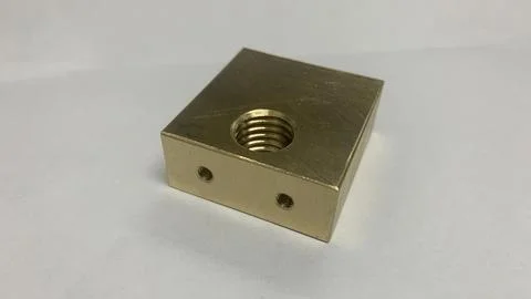 The square brass material with gold color. part on machine industri Stock Photos
