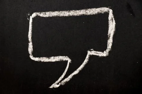 Square bubble speech draw by white chalk on black board background Foto stock