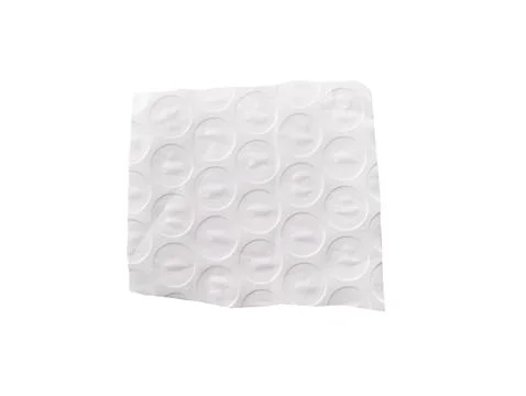 Square bubble wrap piece with circular cells isolated on white. Wrinkled pl.. 스톡 사진