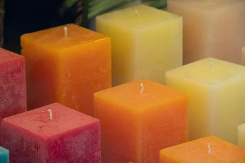 Square candles of different colors Stock Photos