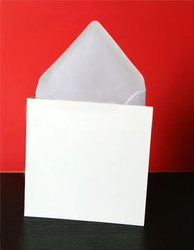 Square card mockup and envelope on black table and red background Stock Photos