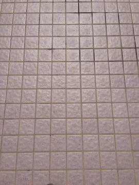 Square ceramic tiles arranged in grid pattern Stock Photos