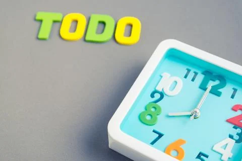 Square clock at 8 o'clock with todo wording on gray background Stock Photos