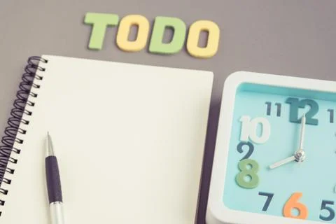 Square clock at 8 o'clock with todo wording and notebook and pen Stock Photos