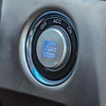 Square Close up view of an engine push start and stop button inside a vehicle Stockfoto's