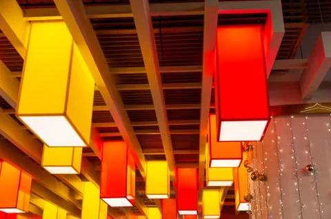 Square colored lamps on the ceiling Stock Photos