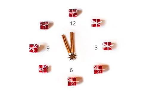 Square composition creative Christmas clock flat lay on white background. Stock Photos