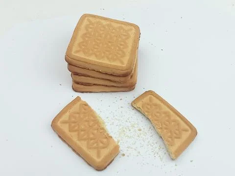 Square cookies stack with broken biscuit and crumbs isolated on white background Stock Photos